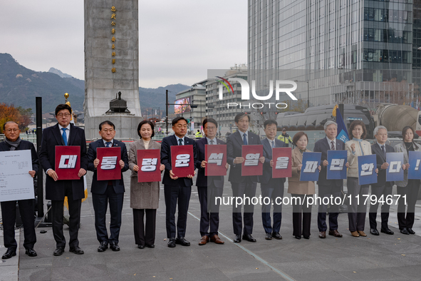 Cho Kuk, leader of the Rebuilding Korea Party, along with party lawmakers, holds a press conference in front of the Admiral Yi Sun-sin statu...