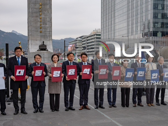 Cho Kuk, leader of the Rebuilding Korea Party, along with party lawmakers, holds a press conference in front of the Admiral Yi Sun-sin statu...