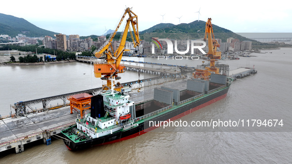 Vehicles shuttle back and forth, and cargo loading and unloading are orderly at Xinhai Wharf in Fuzhou, Fujian province, China, on November...