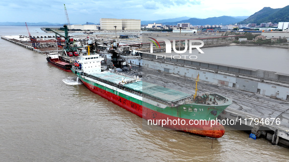 Vehicles shuttle back and forth, and cargo loading and unloading are orderly at Xinhai Wharf in Fuzhou, Fujian province, China, on November...