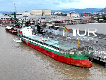 Vehicles shuttle back and forth, and cargo loading and unloading are orderly at Xinhai Wharf in Fuzhou, Fujian province, China, on November...