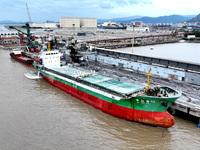 Vehicles shuttle back and forth, and cargo loading and unloading are orderly at Xinhai Wharf in Fuzhou, Fujian province, China, on November...