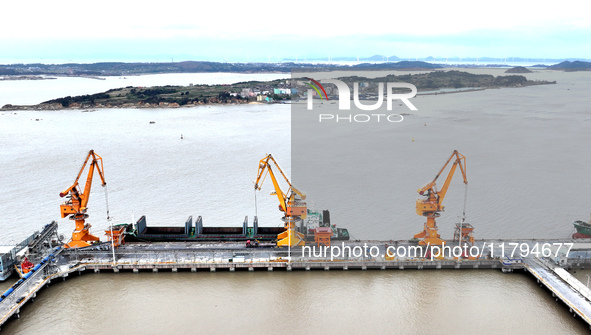 Vehicles shuttle back and forth, and cargo loading and unloading are orderly at Xinhai Wharf in Fuzhou, Fujian province, China, on November...