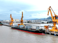 Vehicles shuttle back and forth, and cargo loading and unloading are orderly at Xinhai Wharf in Fuzhou, Fujian province, China, on November...