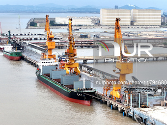 Vehicles shuttle back and forth, and cargo loading and unloading are orderly at Xinhai Wharf in Fuzhou, Fujian province, China, on November...