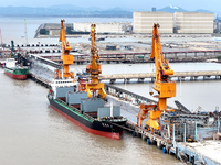 Vehicles shuttle back and forth, and cargo loading and unloading are orderly at Xinhai Wharf in Fuzhou, Fujian province, China, on November...