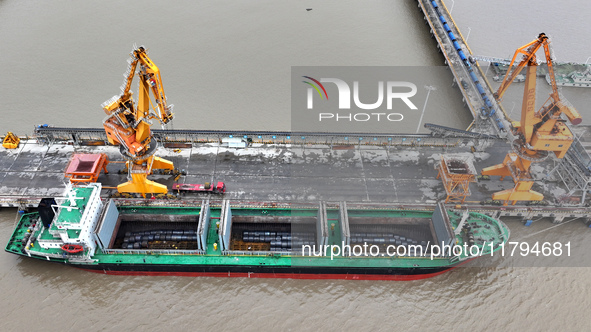 Vehicles shuttle back and forth, and cargo loading and unloading are orderly at Xinhai Wharf in Fuzhou, Fujian province, China, on November...