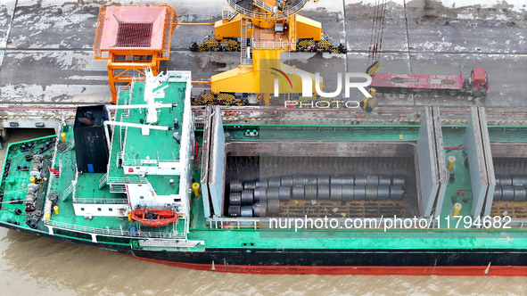 Vehicles shuttle back and forth, and cargo loading and unloading are orderly at Xinhai Wharf in Fuzhou, Fujian province, China, on November...