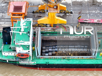 Vehicles shuttle back and forth, and cargo loading and unloading are orderly at Xinhai Wharf in Fuzhou, Fujian province, China, on November...