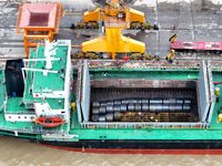 Vehicles shuttle back and forth, and cargo loading and unloading are orderly at Xinhai Wharf in Fuzhou, Fujian province, China, on November...