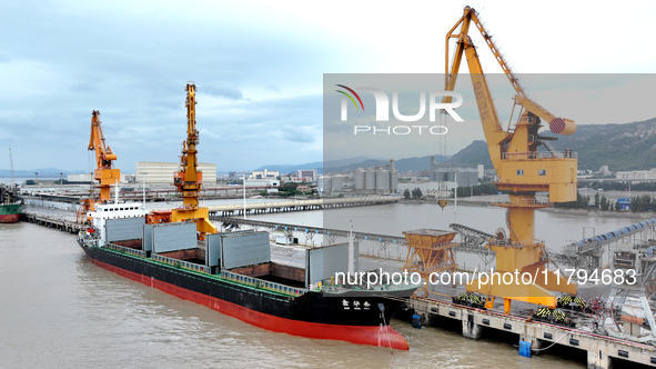 Vehicles shuttle back and forth, and cargo loading and unloading are orderly at Xinhai Wharf in Fuzhou, Fujian province, China, on November...