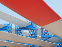 Police check the blades of offshore wind turbines stored at a port in Dongying City, East China, on November 20, 2024. (