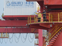 A policeman overlooks the port area in Dongying, China, on November 20, 2024. (