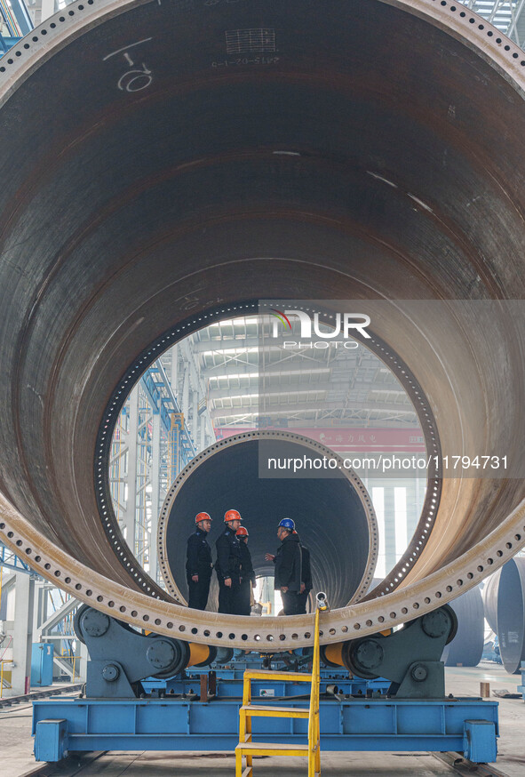 Police inspect an offshore wind power tower barrel manufacturing enterprise in Dongying City, East China, on November 20, 2024. 