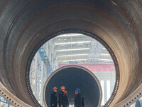 Police inspect an offshore wind power tower barrel manufacturing enterprise in Dongying City, East China, on November 20, 2024. (