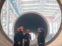 Police inspect an offshore wind power tower barrel manufacturing enterprise in Dongying City, East China, on November 20, 2024. (