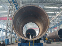 Police inspect an offshore wind power tower barrel manufacturing enterprise in Dongying City, East China, on November 20, 2024. (