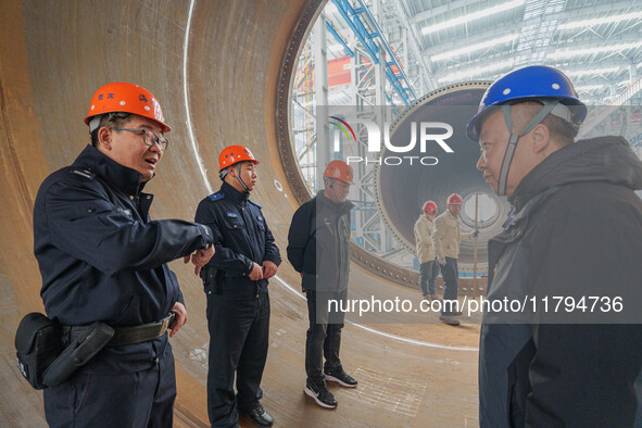 Police inspect an offshore wind power tower barrel manufacturing enterprise in Dongying City, East China, on November 20, 2024. 