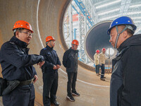 Police inspect an offshore wind power tower barrel manufacturing enterprise in Dongying City, East China, on November 20, 2024. (