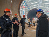 Police inspect an offshore wind power tower barrel manufacturing enterprise in Dongying City, East China, on November 20, 2024. (