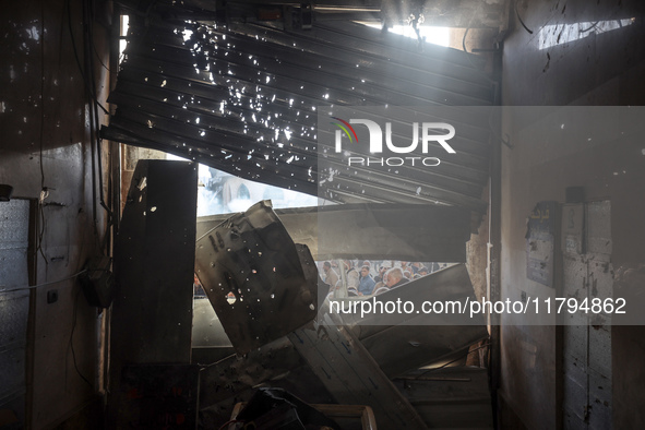 Palestinians wait in a queue to receive bread outside a bakery in Khan Yunis, on November 20, 2024, amid the ongoing war between Israel and...