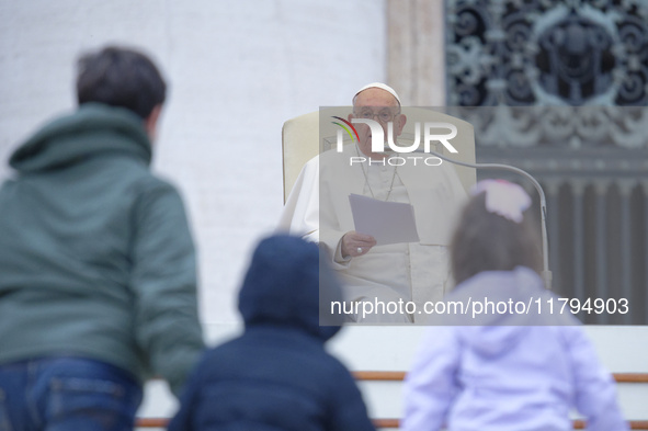 Pope Francis greets a group of children during his weekly general audience in St. Peter's Square at The Vatican, on November 20, 2024. 