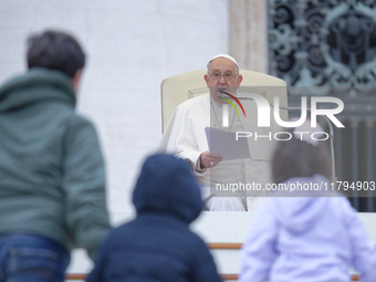 Pope Francis greets a group of children during his weekly general audience in St. Peter's Square at The Vatican, on November 20, 2024. (