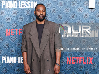 John David Washington arrives at the Los Angeles Premiere Of Netflix's 'The Piano Lesson' held at The Egyptian Theatre Hollywood on November...