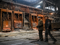 Employees work in an open-hearth furnace shop at Zaporizhstal PJSC in Zaporizhzhia, Ukraine, on November 13, 2024. NO USE RUSSIA. NO USE BEL...