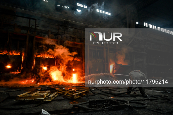 An employee works in an open-hearth furnace shop at Zaporizhstal PJSC in Zaporizhzhia, Ukraine, on November 13, 2024. NO USE RUSSIA. NO USE...