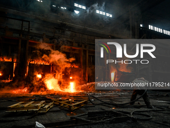 An employee works in an open-hearth furnace shop at Zaporizhstal PJSC in Zaporizhzhia, Ukraine, on November 13, 2024. NO USE RUSSIA. NO USE...