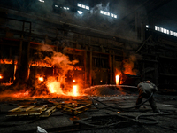 An employee works in an open-hearth furnace shop at Zaporizhstal PJSC in Zaporizhzhia, Ukraine, on November 13, 2024. NO USE RUSSIA. NO USE...