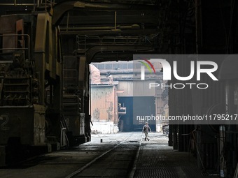 An employee works in an open-hearth furnace shop at Zaporizhstal PJSC in Zaporizhzhia, Ukraine, on November 13, 2024. NO USE RUSSIA. NO USE...