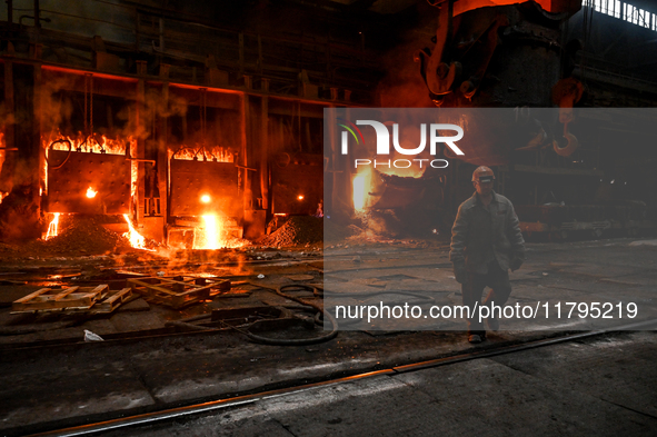 An employee works in an open-hearth furnace shop at Zaporizhstal PJSC in Zaporizhzhia, Ukraine, on November 13, 2024. NO USE RUSSIA. NO USE...