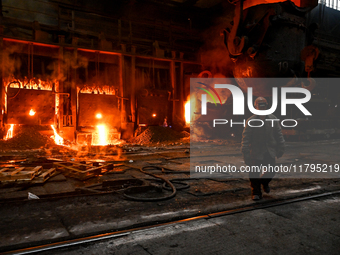 An employee works in an open-hearth furnace shop at Zaporizhstal PJSC in Zaporizhzhia, Ukraine, on November 13, 2024. NO USE RUSSIA. NO USE...