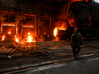 An employee works in an open-hearth furnace shop at Zaporizhstal PJSC in Zaporizhzhia, Ukraine, on November 13, 2024. NO USE RUSSIA. NO USE...