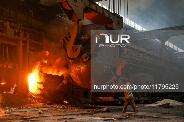 An employee works in an open-hearth furnace shop at Zaporizhstal PJSC in Zaporizhzhia, Ukraine, on November 13, 2024. NO USE RUSSIA. NO USE...