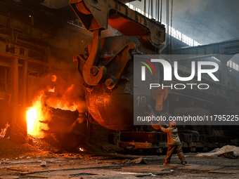 An employee works in an open-hearth furnace shop at Zaporizhstal PJSC in Zaporizhzhia, Ukraine, on November 13, 2024. NO USE RUSSIA. NO USE...