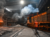 An employee works in an open-hearth furnace shop at Zaporizhstal PJSC in Zaporizhzhia, Ukraine, on November 13, 2024. NO USE RUSSIA. NO USE...