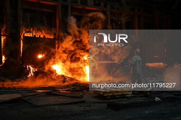 An employee works in an open-hearth furnace shop at Zaporizhstal PJSC in Zaporizhzhia, Ukraine, on November 13, 2024. NO USE RUSSIA. NO USE...