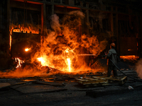 An employee works in an open-hearth furnace shop at Zaporizhstal PJSC in Zaporizhzhia, Ukraine, on November 13, 2024. NO USE RUSSIA. NO USE...