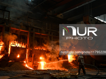 An employee works in an open-hearth furnace shop at Zaporizhstal PJSC in Zaporizhzhia, Ukraine, on November 13, 2024. NO USE RUSSIA. NO USE...