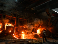 An employee works in an open-hearth furnace shop at Zaporizhstal PJSC in Zaporizhzhia, Ukraine, on November 13, 2024. NO USE RUSSIA. NO USE...