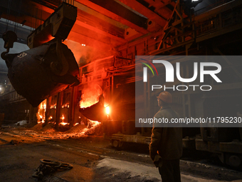 An employee works in an open-hearth furnace shop at Zaporizhstal PJSC in Zaporizhzhia, Ukraine, on November 13, 2024. NO USE RUSSIA. NO USE...