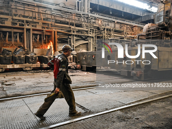 An employee works in an open-hearth furnace shop at Zaporizhstal PJSC in Zaporizhzhia, Ukraine, on November 13, 2024. NO USE RUSSIA. NO USE...