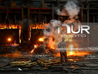 An employee works in an open-hearth furnace shop at Zaporizhstal PJSC in Zaporizhzhia, Ukraine, on November 13, 2024. NO USE RUSSIA. NO USE...