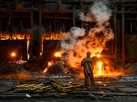 An employee works in an open-hearth furnace shop at Zaporizhstal PJSC in Zaporizhzhia, Ukraine, on November 13, 2024. NO USE RUSSIA. NO USE...