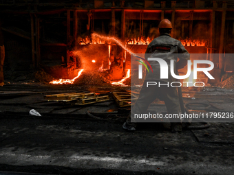 An employee works in an open-hearth furnace shop at Zaporizhstal PJSC in Zaporizhzhia, Ukraine, on November 13, 2024. NO USE RUSSIA. NO USE...