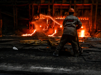 An employee works in an open-hearth furnace shop at Zaporizhstal PJSC in Zaporizhzhia, Ukraine, on November 13, 2024. NO USE RUSSIA. NO USE...