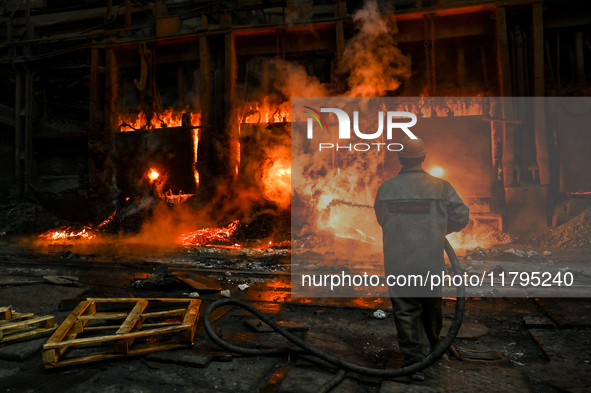 An employee works in an open-hearth furnace shop at Zaporizhstal PJSC in Zaporizhzhia, Ukraine, on November 13, 2024. NO USE RUSSIA. NO USE...